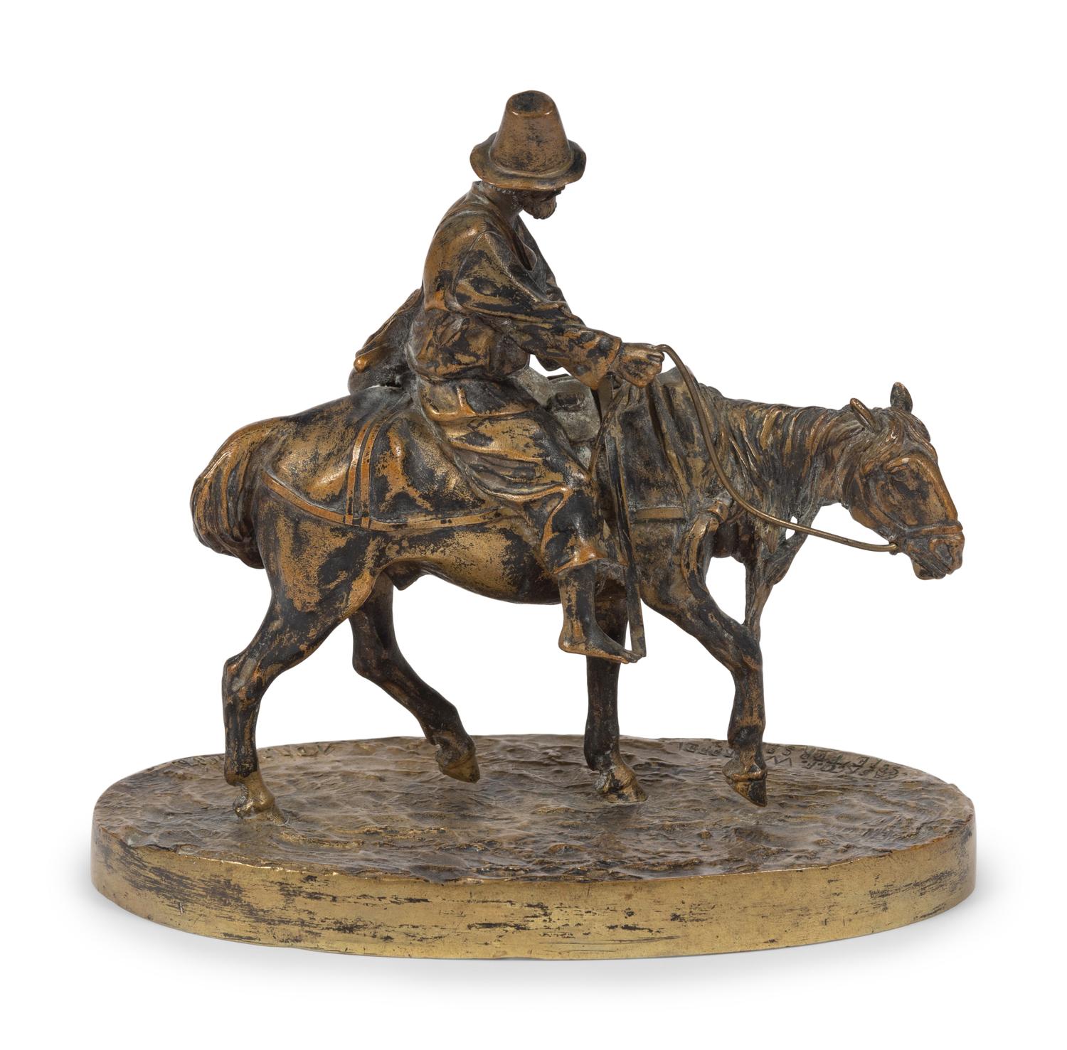 A Russian Gilt Bronze Figural Group of a Man on Horseback