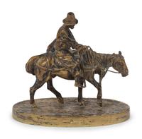 A Russian Gilt Bronze Figural Group of a Man on Horseback