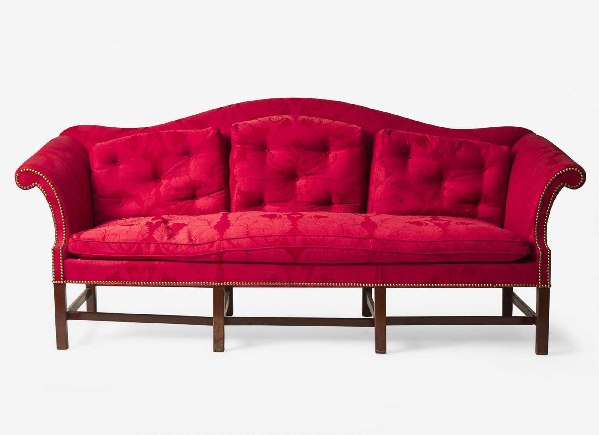 An impressive Chippendale camelback mahogany sofa with red damask upholstery, possibly 18th century and later