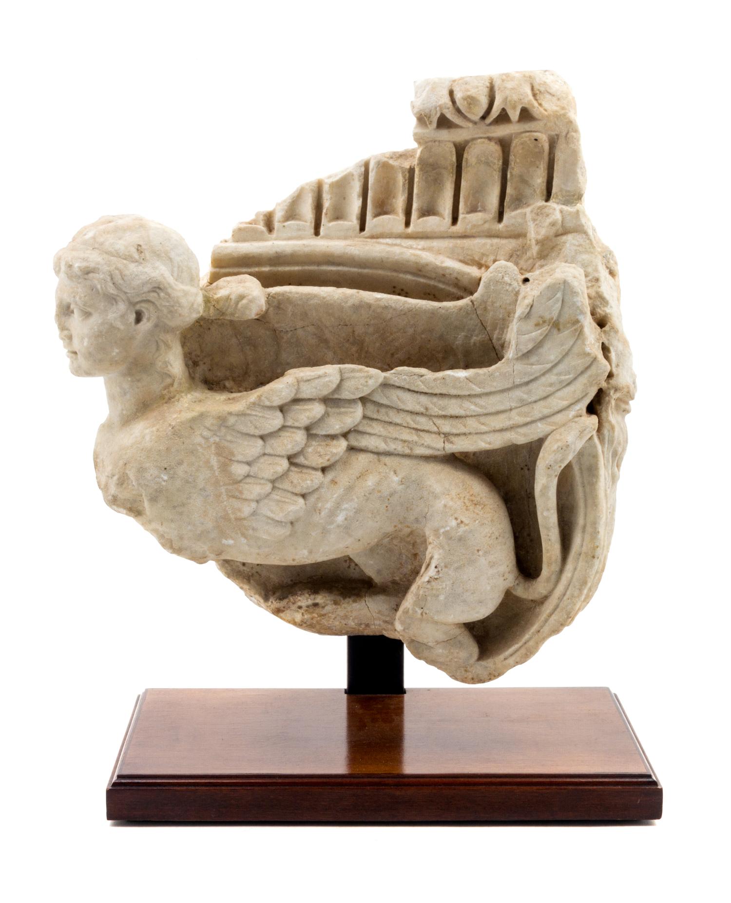 A Roman Marble Ionic Capital Height 14 1/2 x width 13 inches. — FIRST CENTURY A.D.