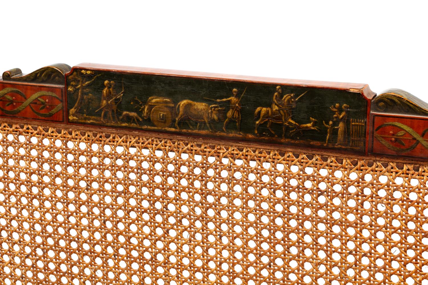 An Edwardian Painted Satinwood Caned Settee