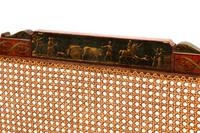 An Edwardian Painted Satinwood Caned Settee