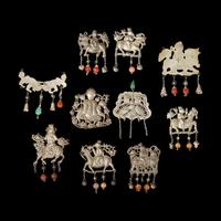 A Group of 10 Assorted Chinese Silver 'Boy and Qilin' Pendants, Late Qing Dynasty-Republic Period 晚清-民國 銀麒麟送子墜瑪瑙長命鎖及其他一組十件