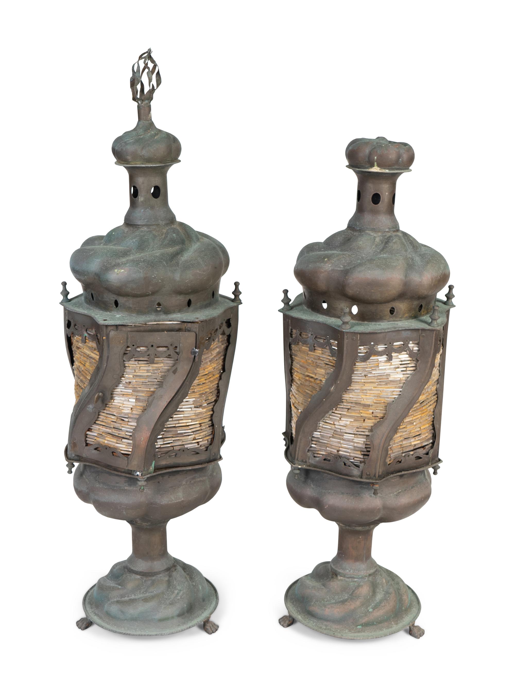 A Pair of Middle Eastern Patinated Metal And Beaded Glass Lanterns