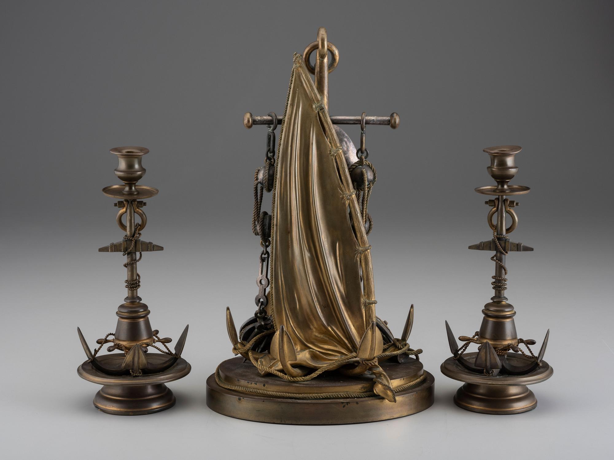 A Cast Brass and Steel Anchor Form Mantel Clock Garniture
