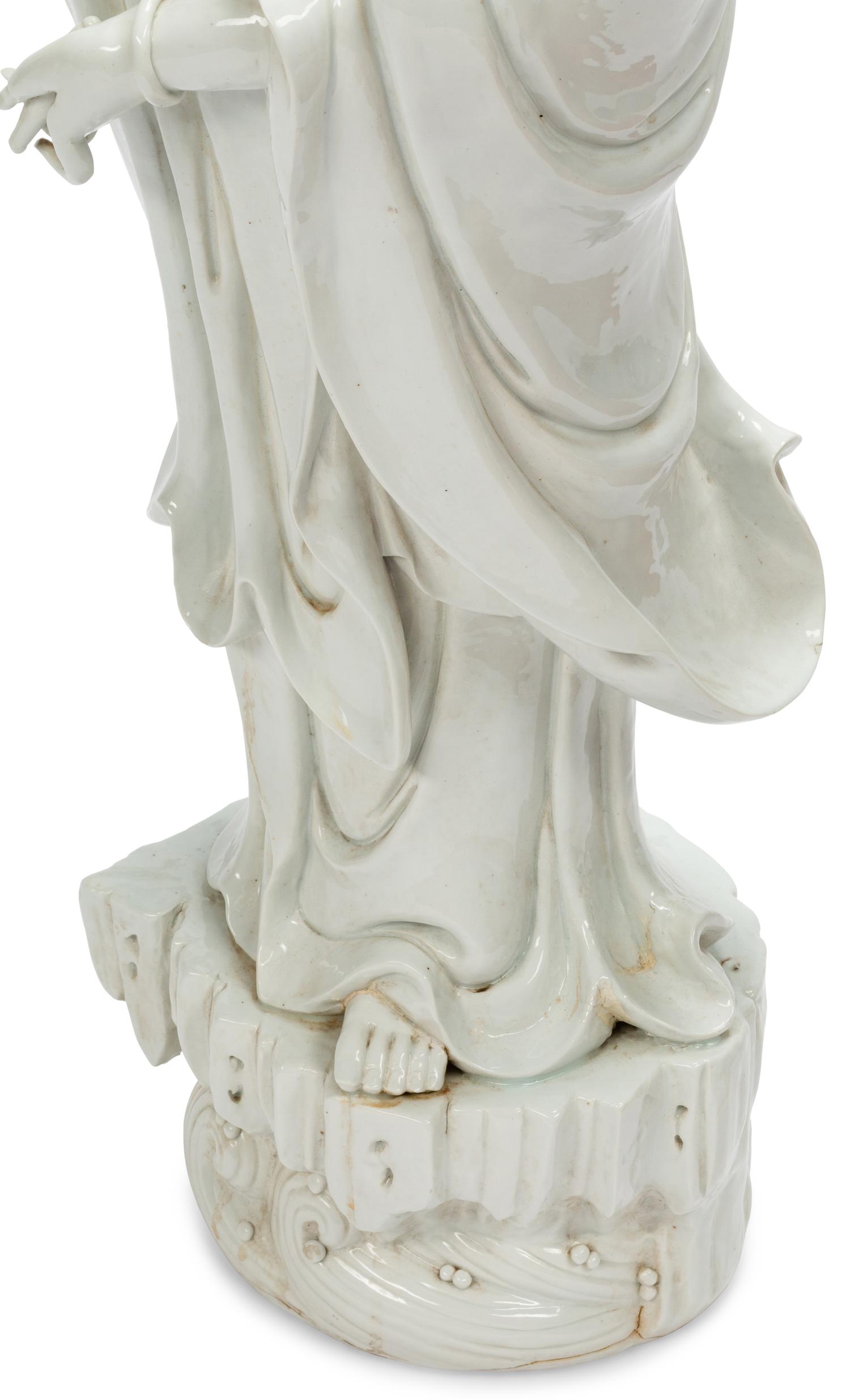 A Large Chinese Export White Glazed Porcelain Figure of Guanyin