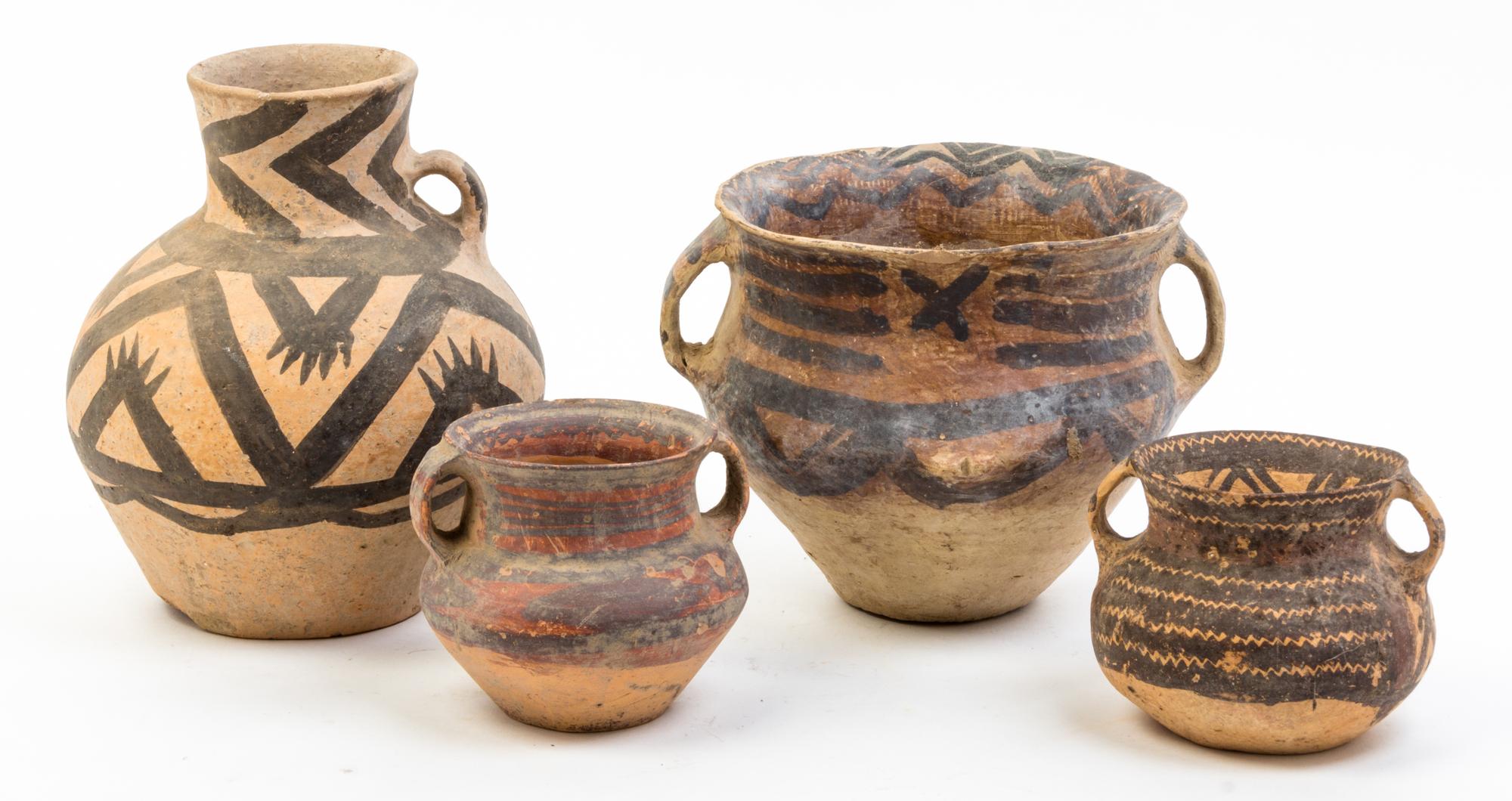 A Group of Six Neolithic Style Pottery Vessels Height of tallest 10 1/4 inches.