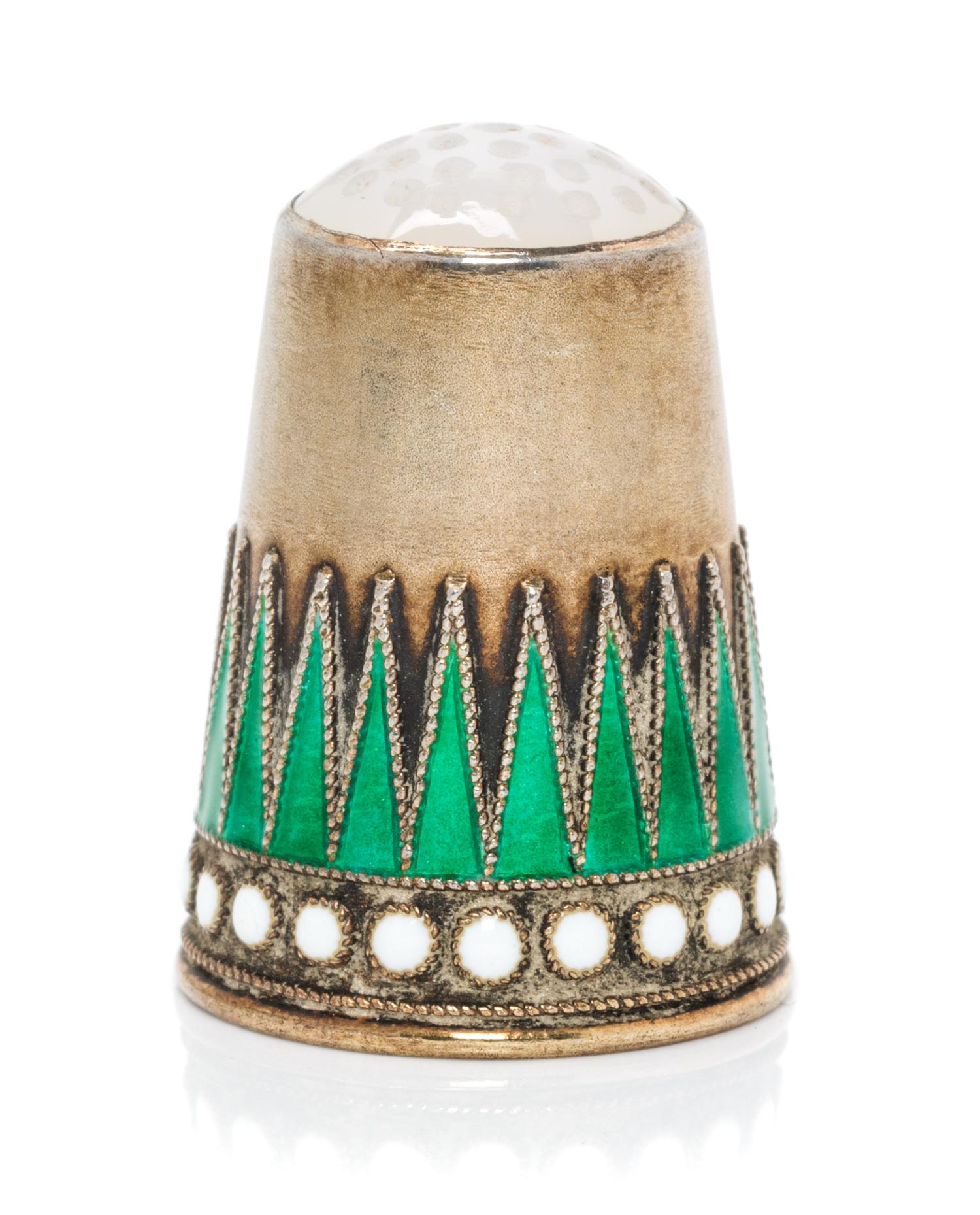 A Norwegian Silver-Gilt and Enamel Thimble, Marius Hammer, Bergen, Late 19th Century, the hardstone inset top above a body with a conti