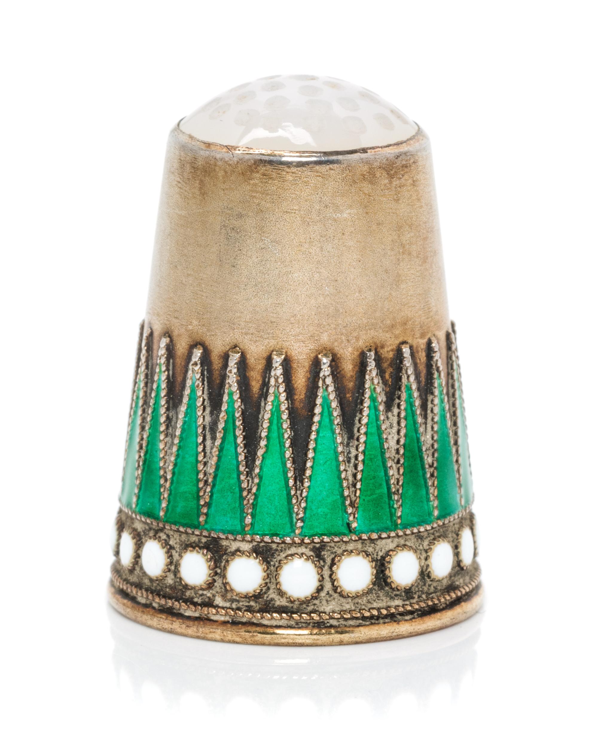 A Norwegian Silver-Gilt and Enamel Thimble, Marius Hammer, Bergen, Late 19th Century, the hardstone inset top above a body with a conti