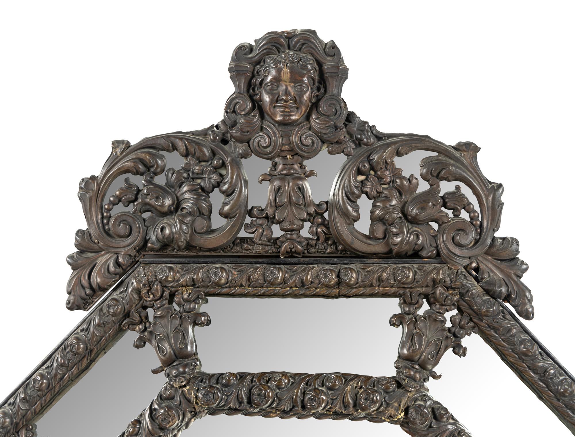 A Dutch Baroque Style Pressed Brass Mirror