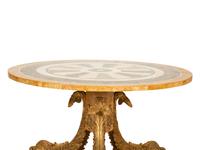 An Italian Design Pietra Dura Center Table with Carved Giltwood Dolphin Base
