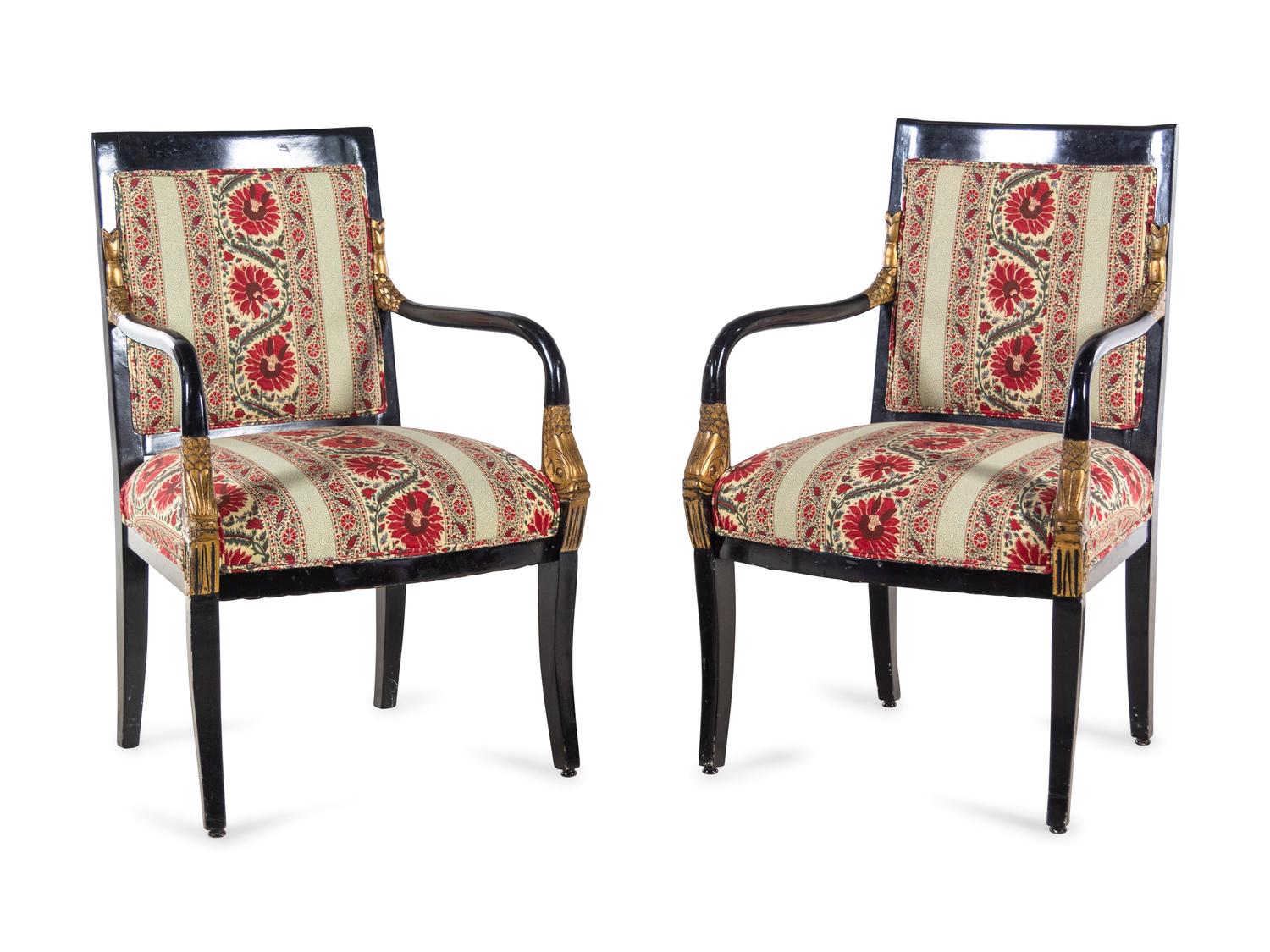 A Pair of Louis Philippe Style Parcel Gilt and Ebonized Armchairs