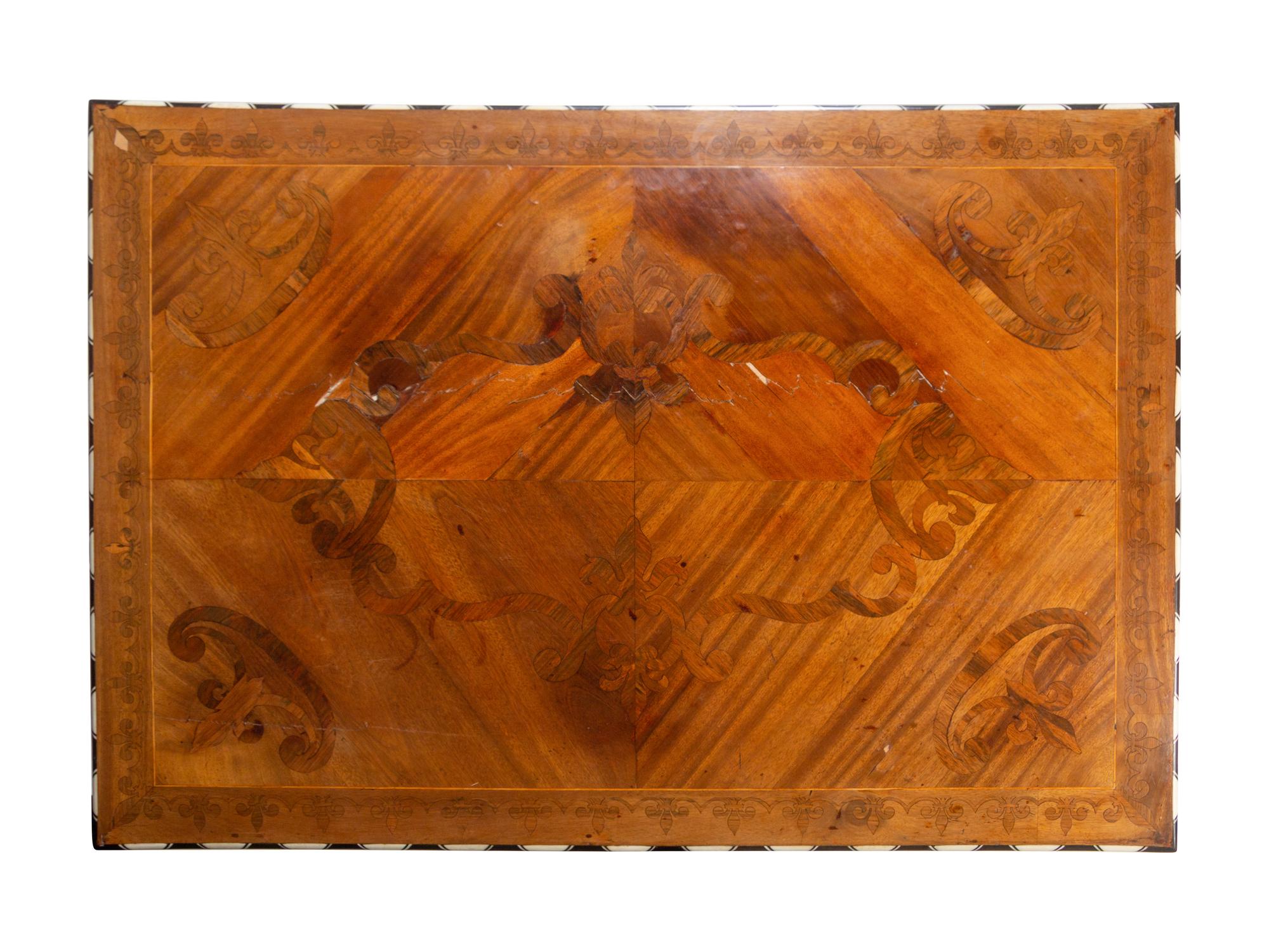 A Northern Italian Bone Inlaid Marquetry, Walnut and Ebony Center Table