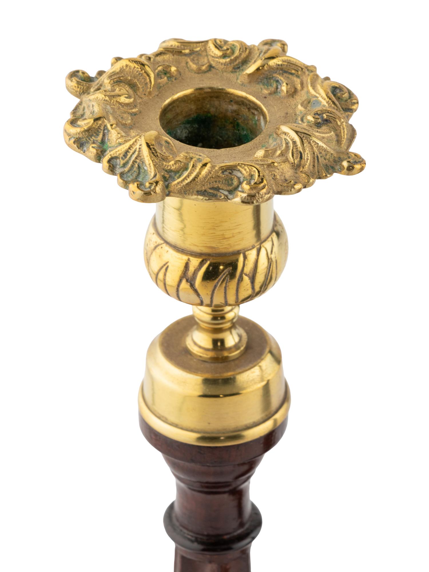 A Group of Four English Mahogany and Brass Mounted Candlesticks