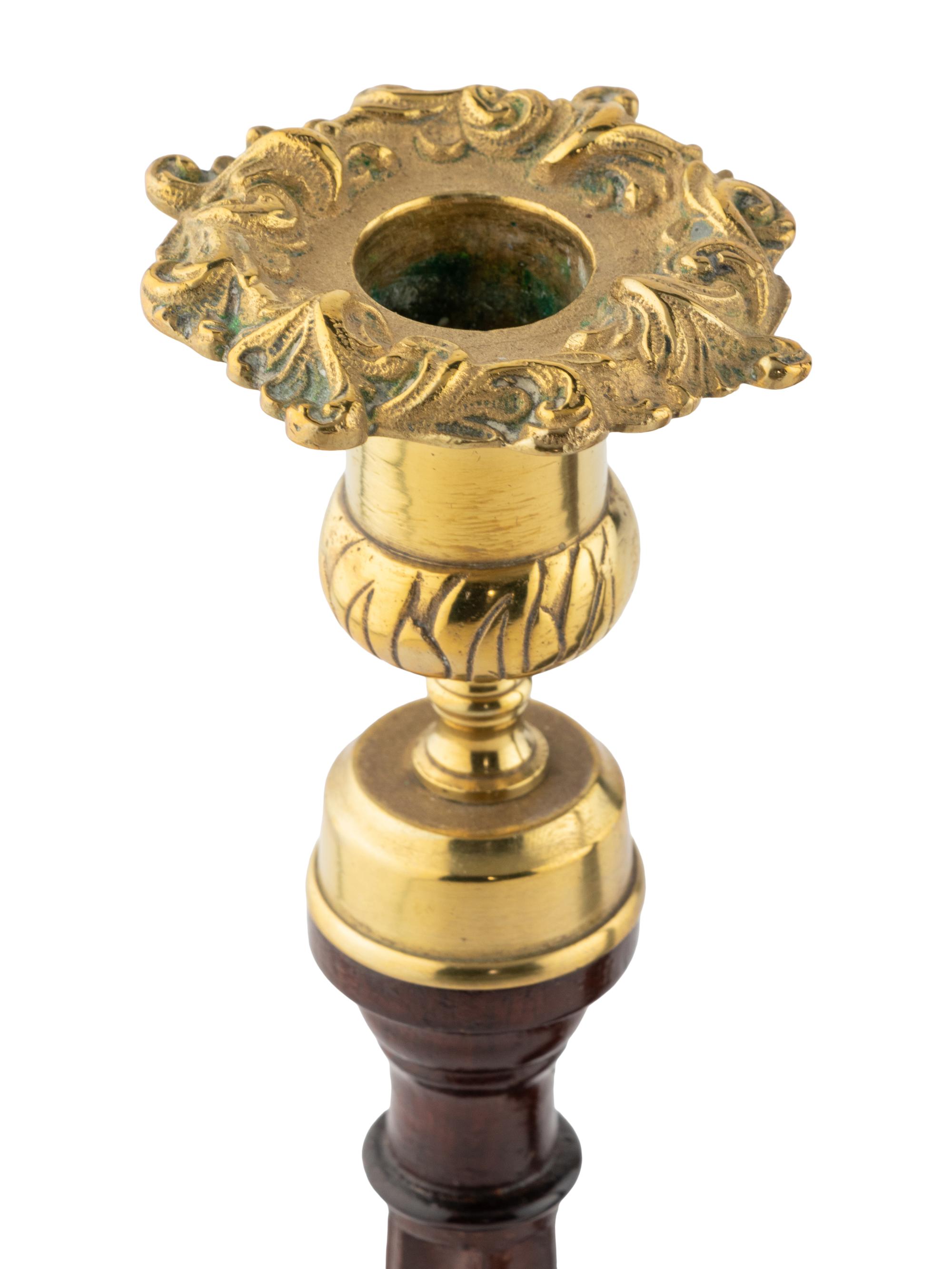 A Group of Four English Mahogany and Brass Mounted Candlesticks