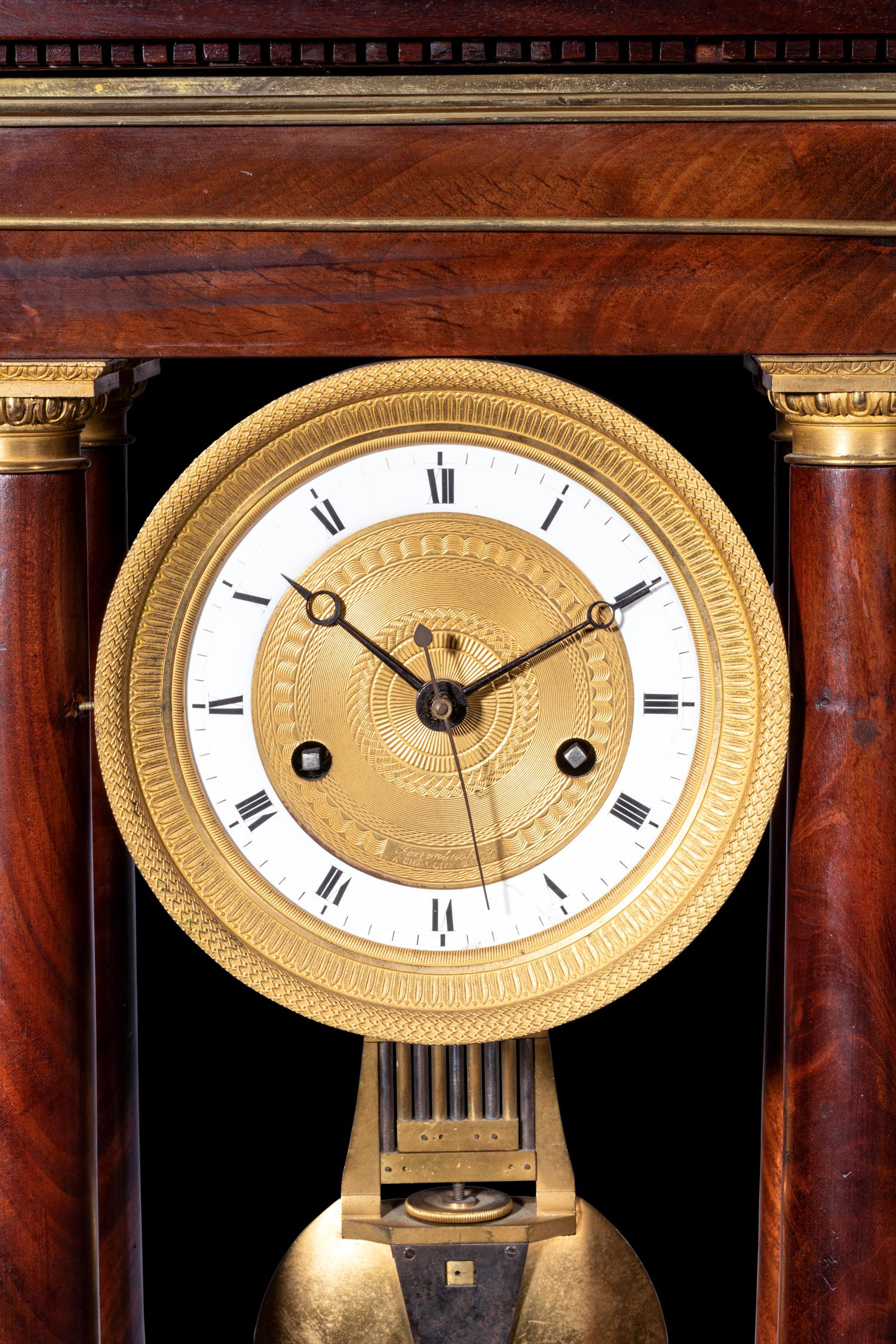 A French Gilt Bronze Mounted Mahogany Portico Clock, Ferrenbach, Chalons