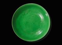 An incised green-glazed "Bajixiang" dish, Yongzheng six-character mark and of the period 暗刻“八吉祥”綠釉盤 雍正六字款 清雍正