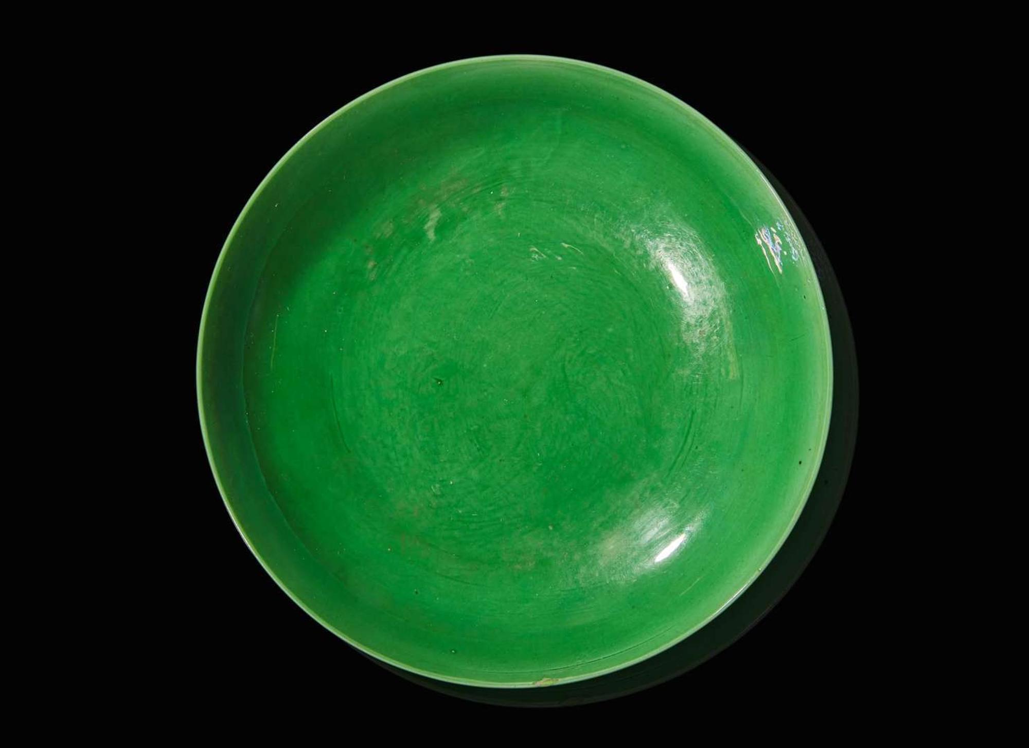 An incised green-glazed "Bajixiang" dish, Yongzheng six-character mark and of the period 暗刻“八吉祥”綠釉盤 雍正六字款 清雍正