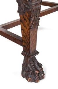 A Set of Eight R.J. Horner Carved Oak Man of the Mountain Dining Chairs