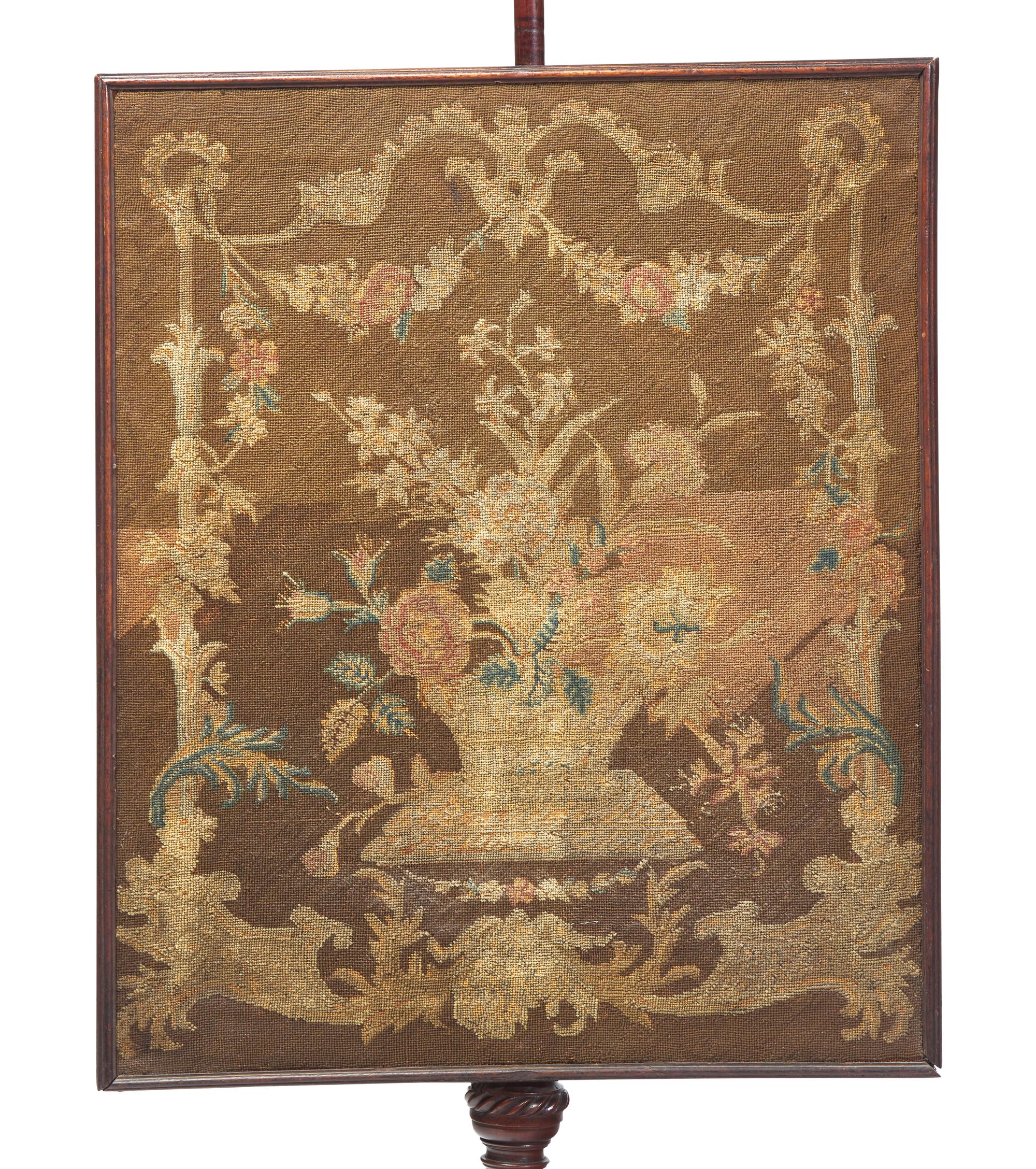 A George III Carved Mahogany Fire Screen With Petit Point Needlework Panel