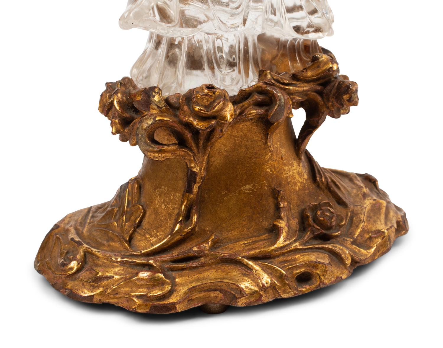 A Carved Rock Crystal Figure of Guanyin on a Giltwood Base