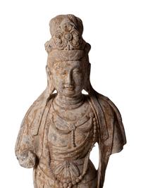 A Chinese Carved Stone Standing Guanyin Figure with Remnants of Polychrome Decoration