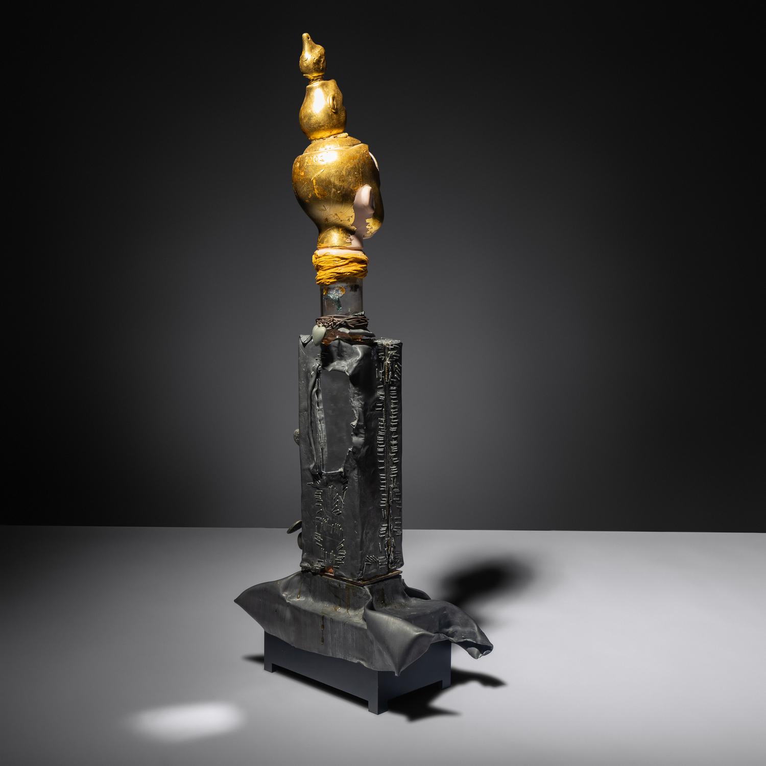 Sculpture with doll's head
