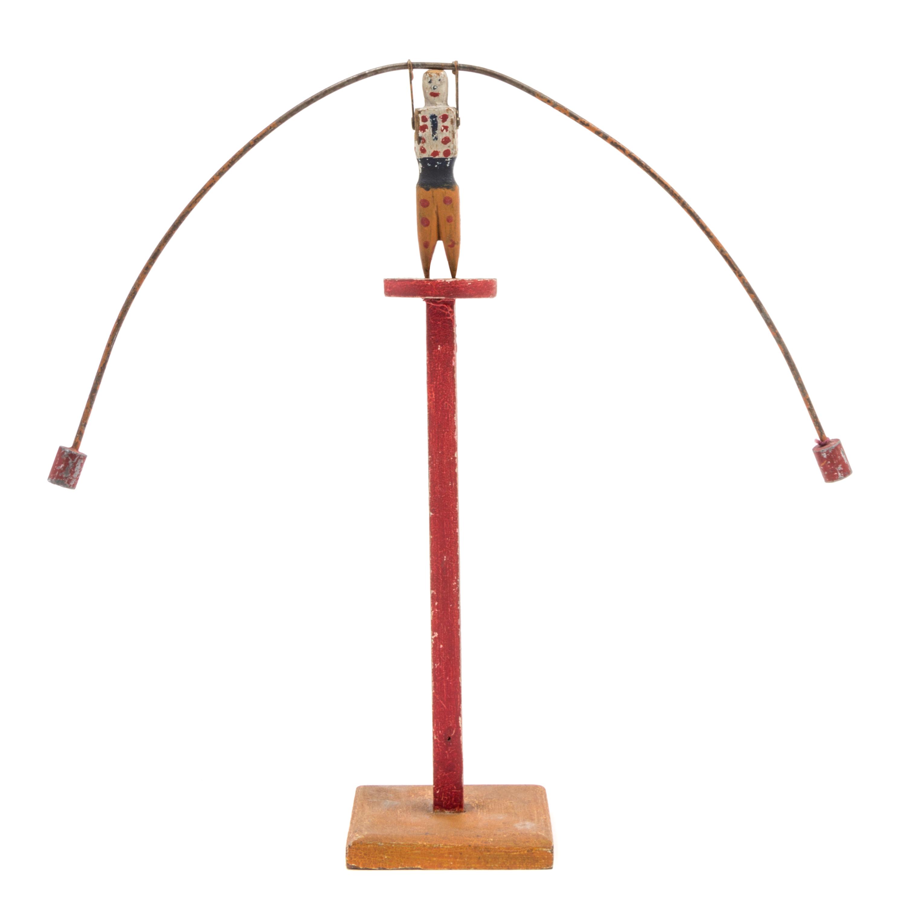 An American Wood and Metal Balancing Toy Height overall 13 3/4 inches.