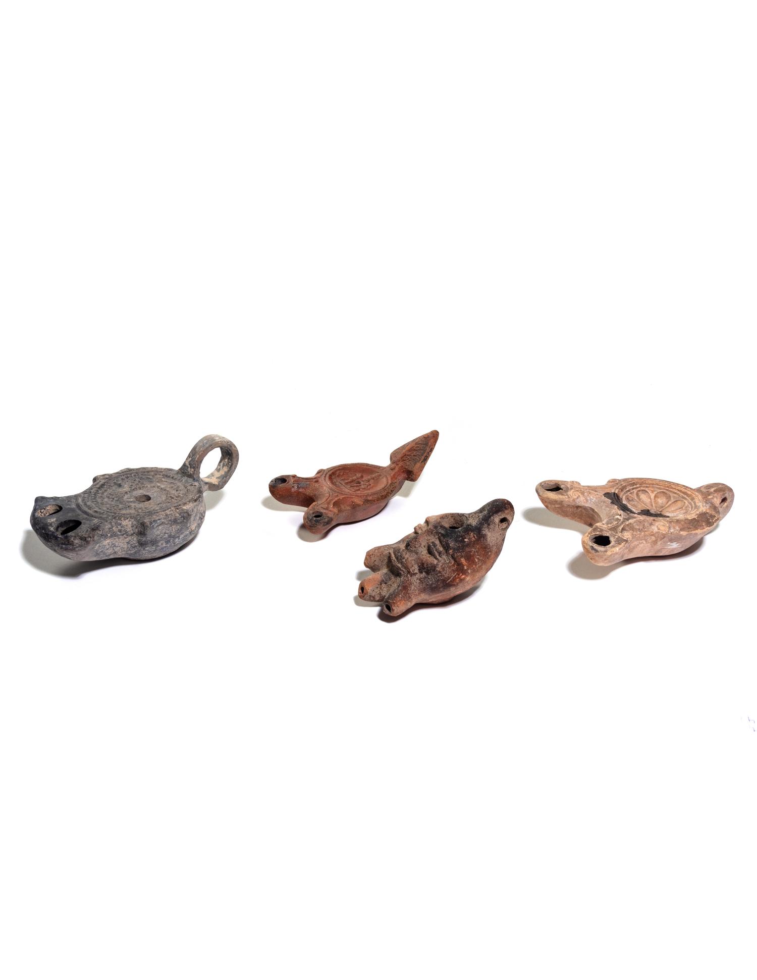 Five Roman Molded Terra Cotta Oil Lamps