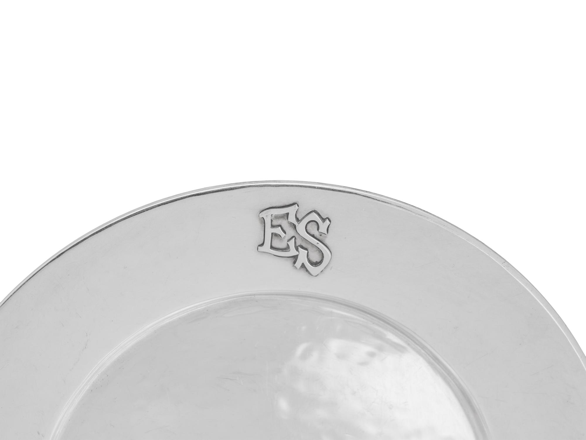 A Set of Twelve American Arts and Crafts Silver Bread Plates