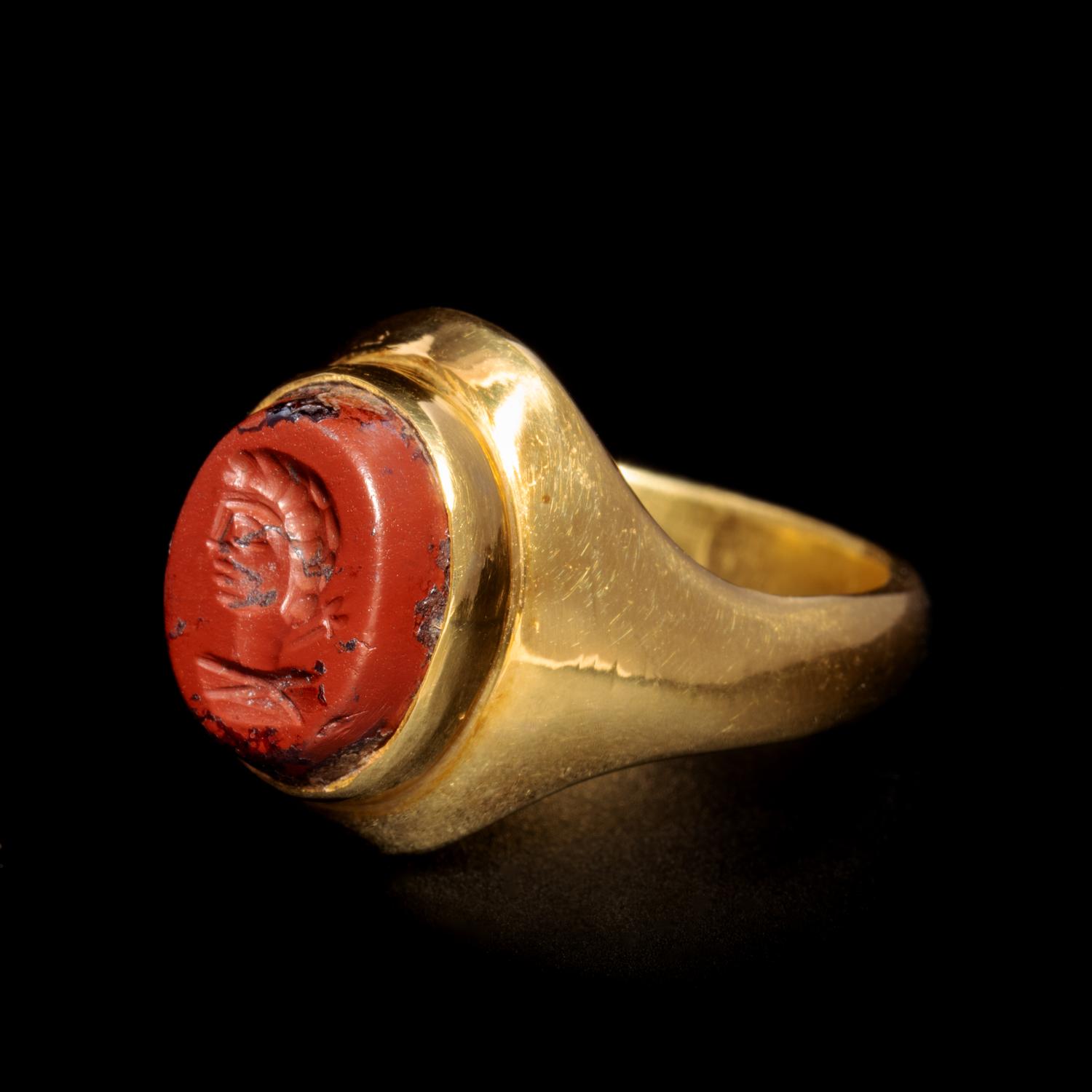 A Roman Gold and Red Jasper Finger Ring Engraved with the Bust of a Man