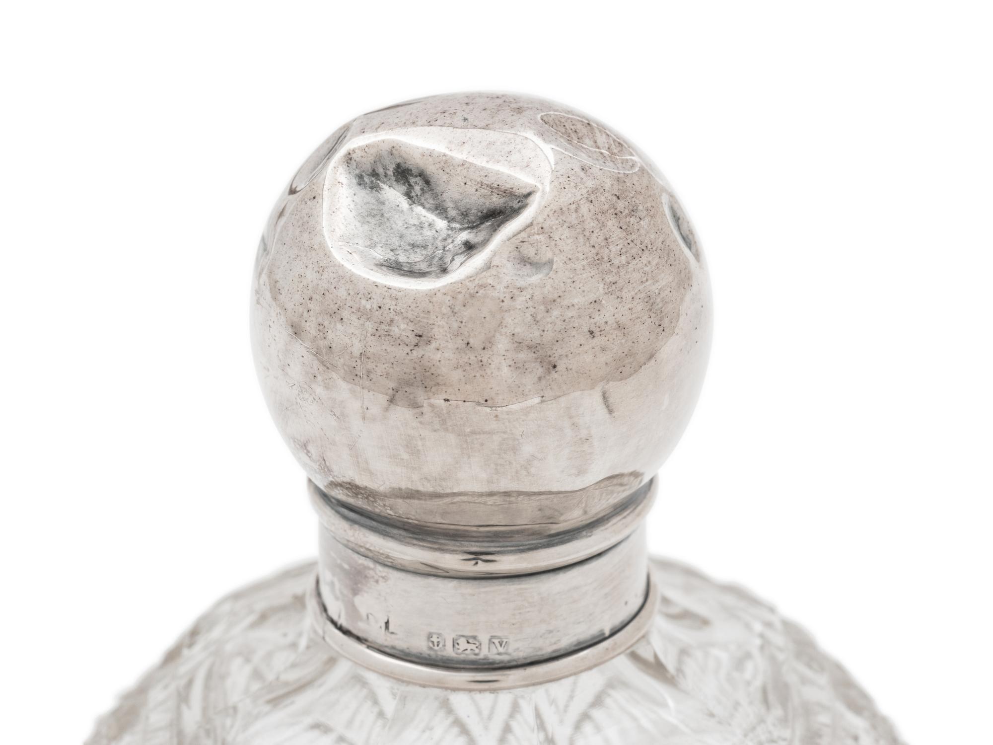 Four English Silver Mounted Cut Glass Bottles