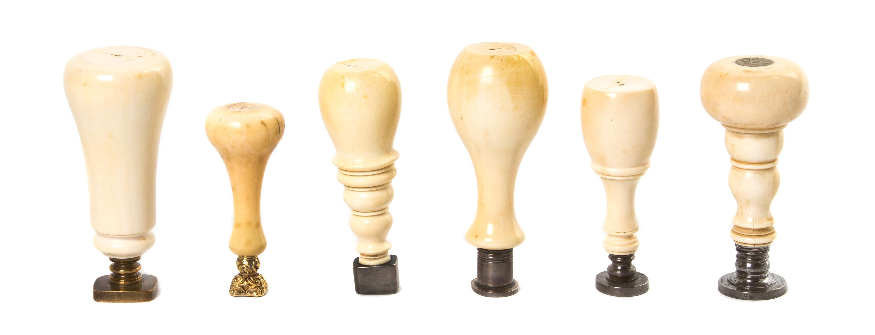 A Collection of Turned Ivory Seals, Height of tallest 3 1/2 inches.