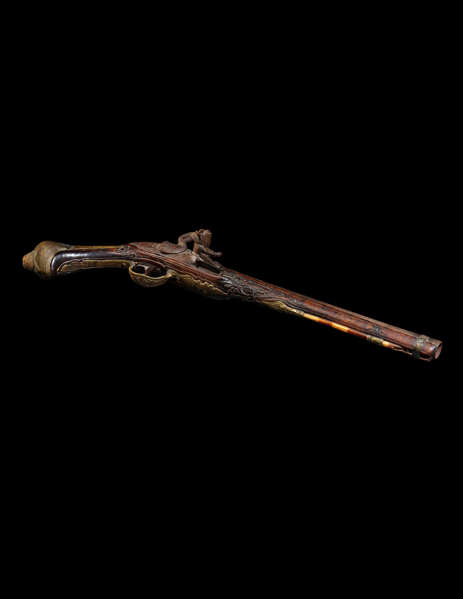 An Engraved Brass-Mounted Flintlock Pistol