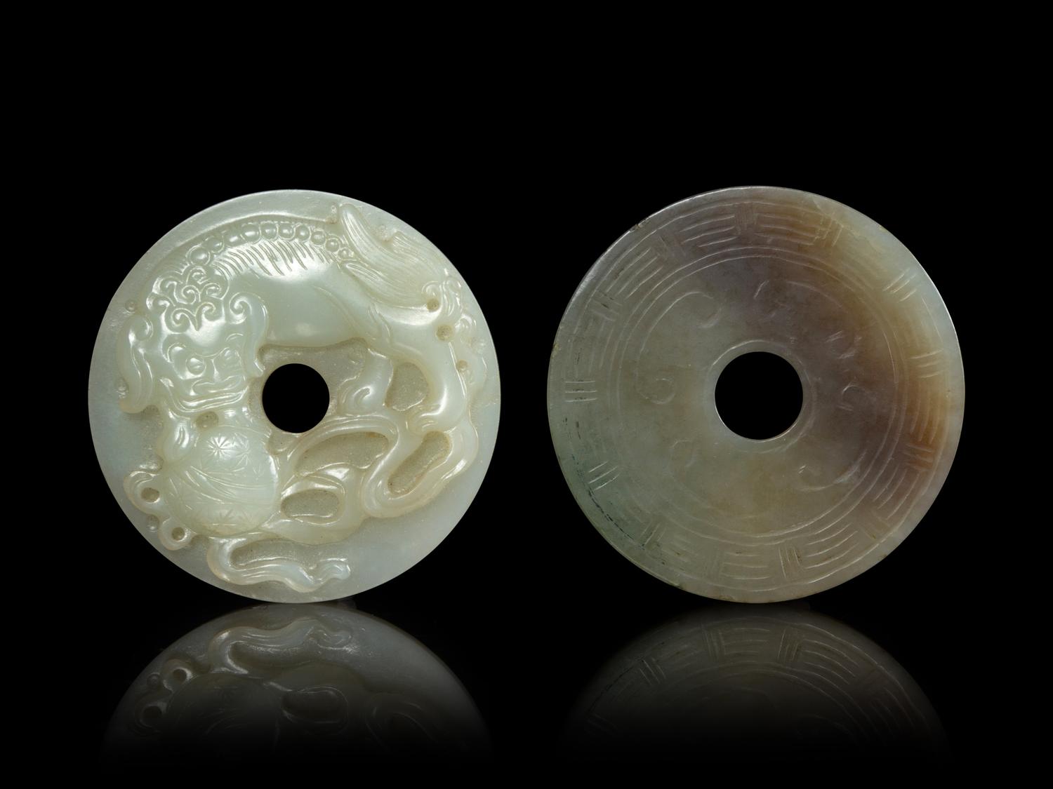 Two Jade Bi- Form Pendants