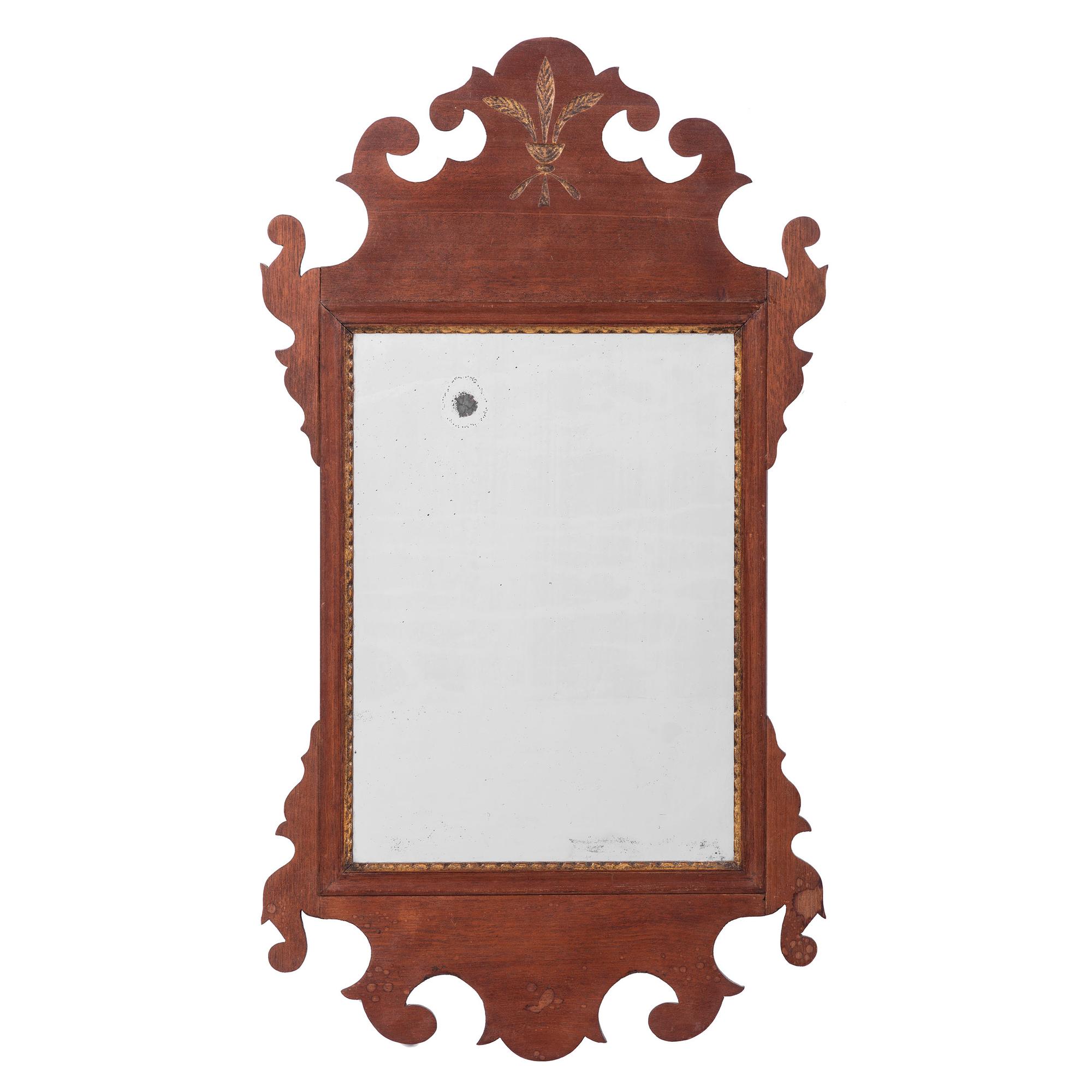 A Chippendale Parcel Gilt Mahogany Looking Glass and a Classical Parcel Gilt and Reverse Painted Looking Glass