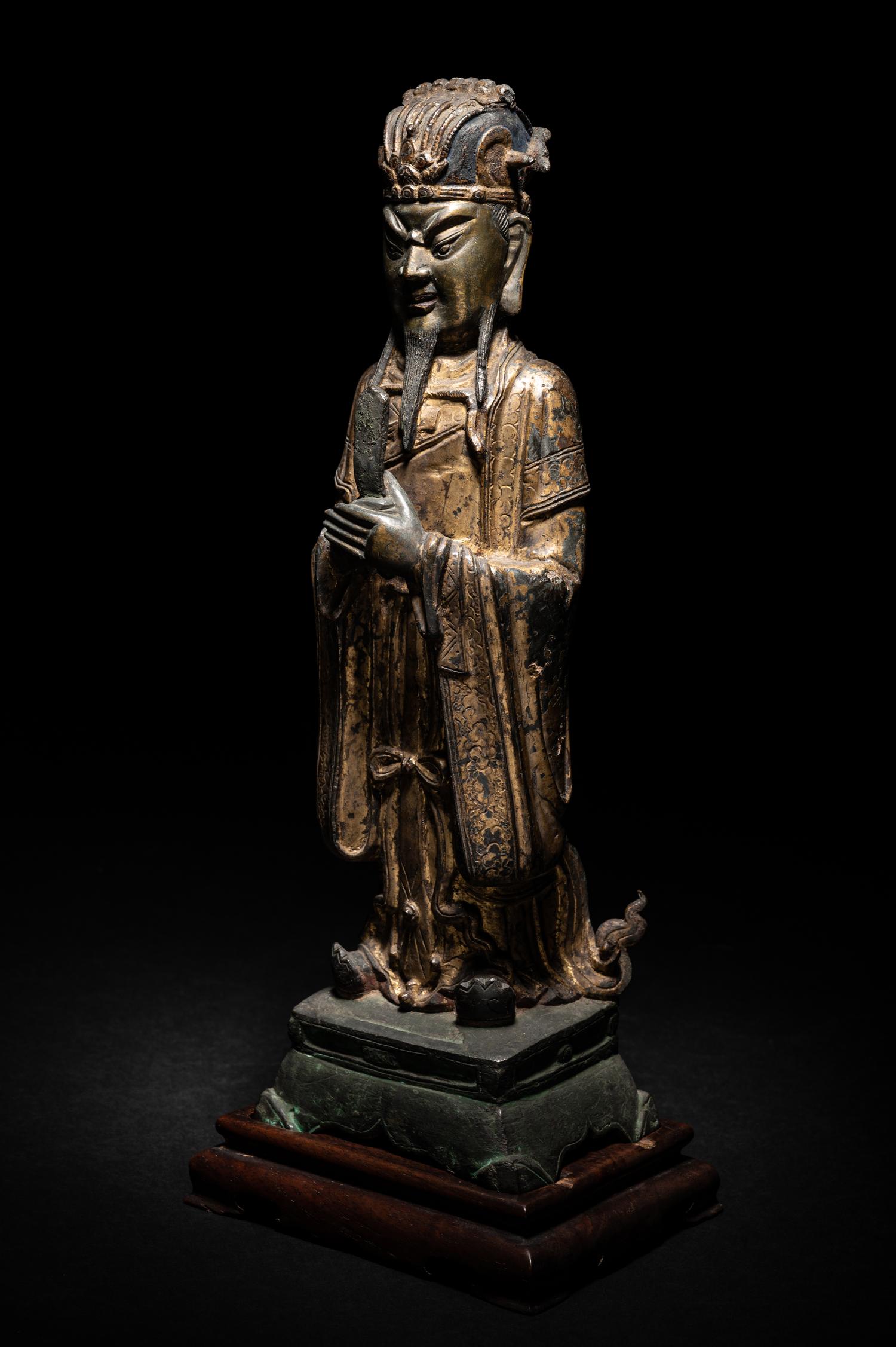 A Pair of Chinese Gilt Decorated Bronze Figures of Standing Officials