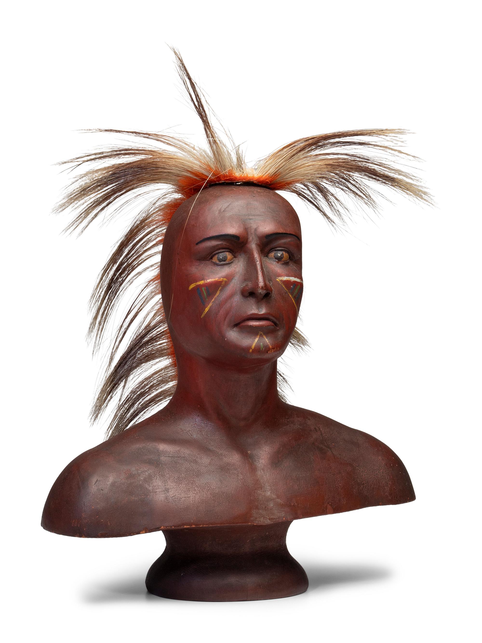 A Carved and Painted Pine Bust of a Native American