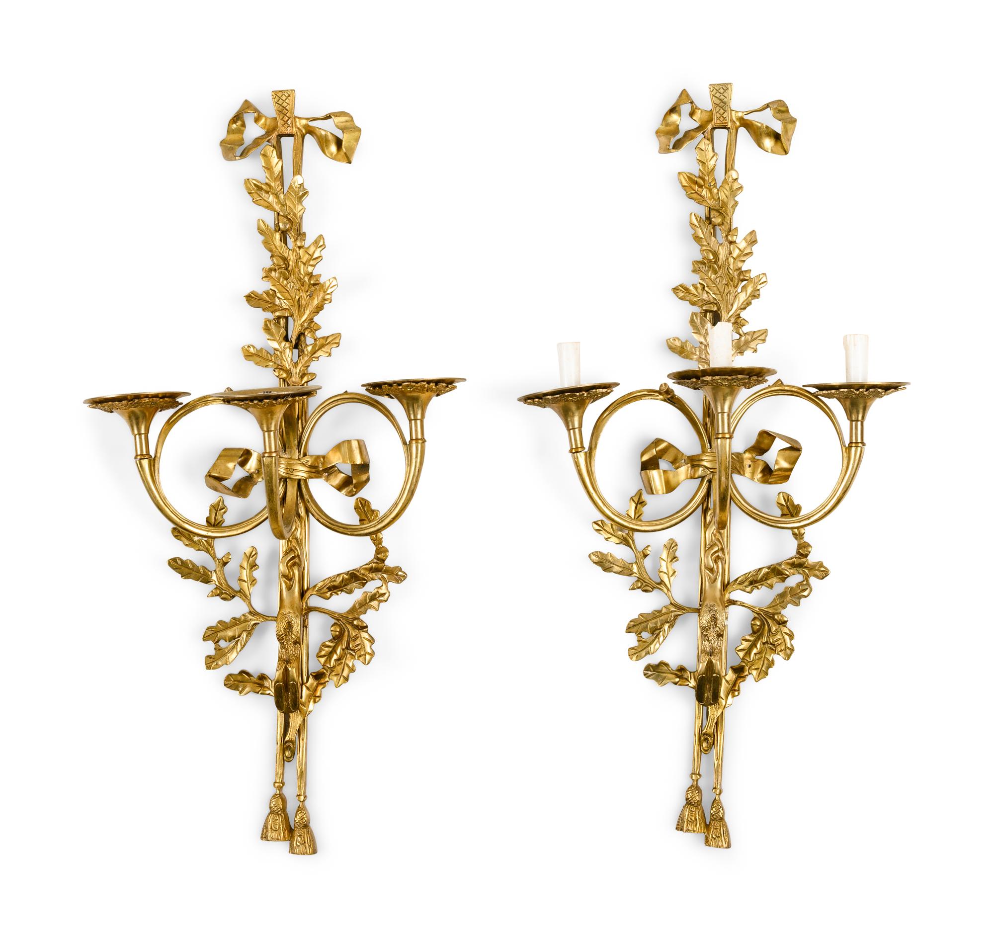 A Pair of Louis XVI Style Gilt Metal Three-Light Wall Sconces