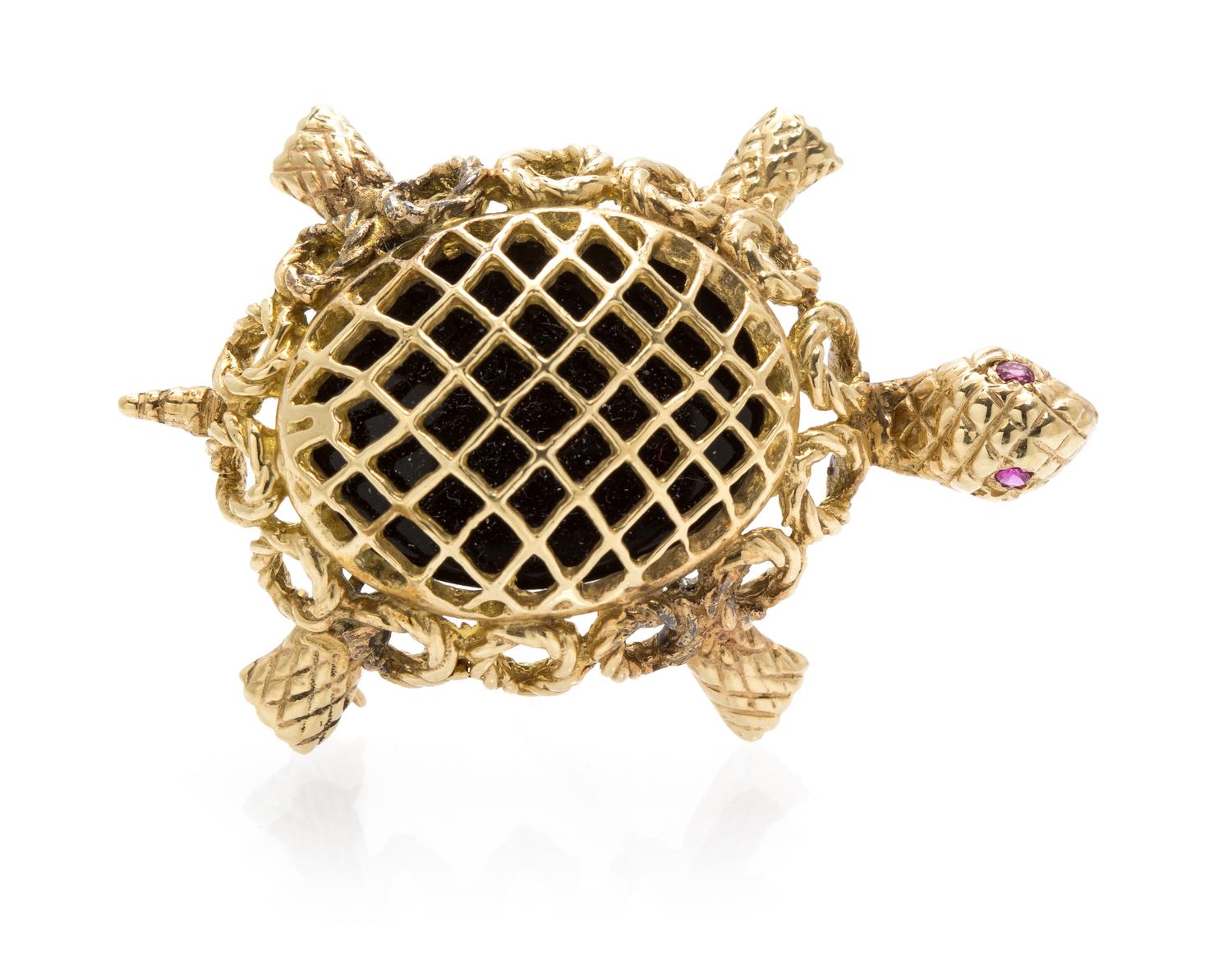 A Yellow Gold, Onyx and Ruby Turtle Brooch, 6.80 dwts.