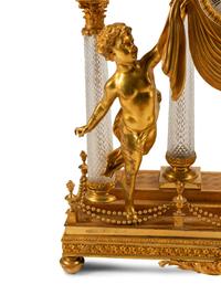 A Louis XV Style Gilt Bronze, Porcelain and Cut Glass Clock Garniture