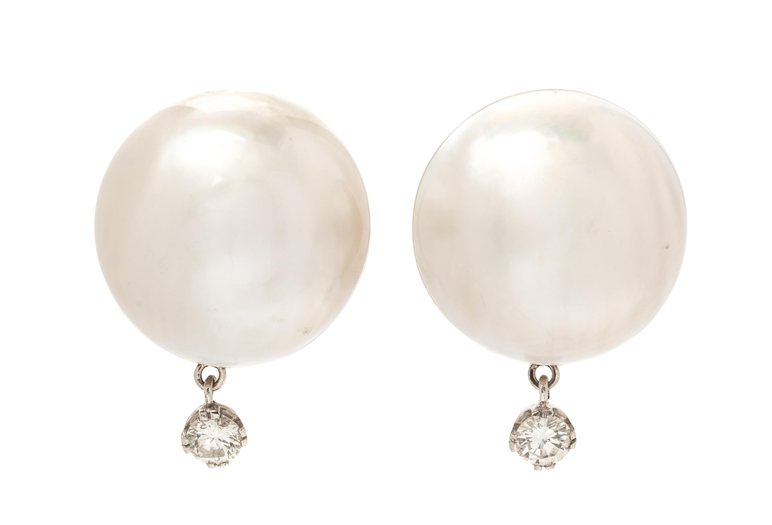 A Pair of White Gold, Mabe Pearl and Diamond Earclips, 8.90 dwts.