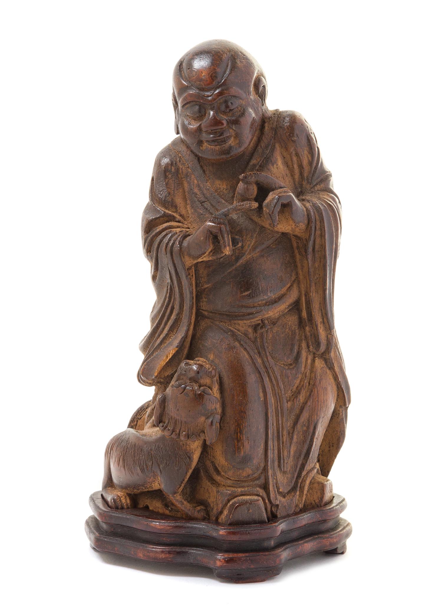 A Carved Bamboo Figure of an Immortal Height overall 8 1/4 inches.