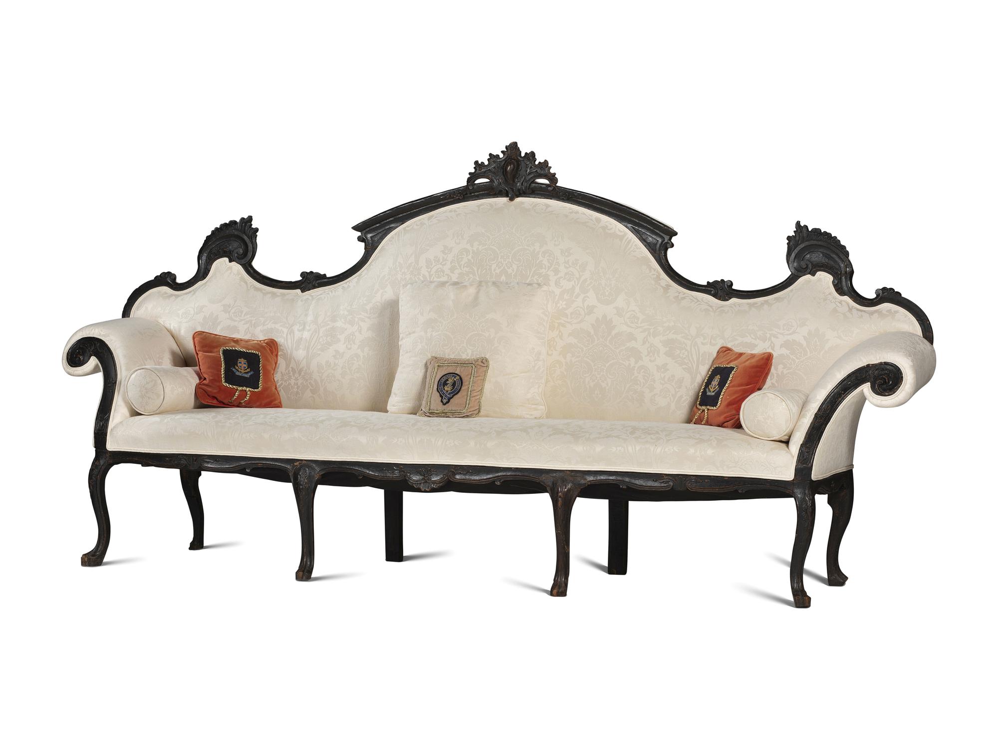 An Italian Carved and Black Painted Walnut High-Back Sofa