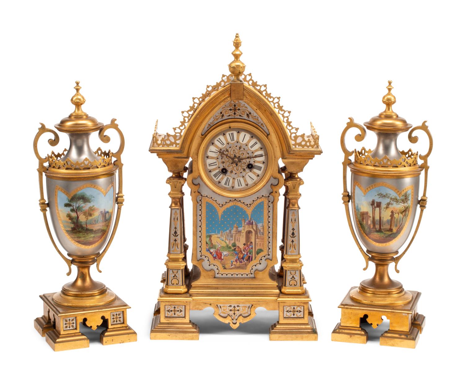 A French Gilt and Silvered Bronze and Porcelain Clock Garniture