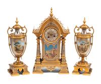 A French Gilt and Silvered Bronze and Porcelain Clock Garniture