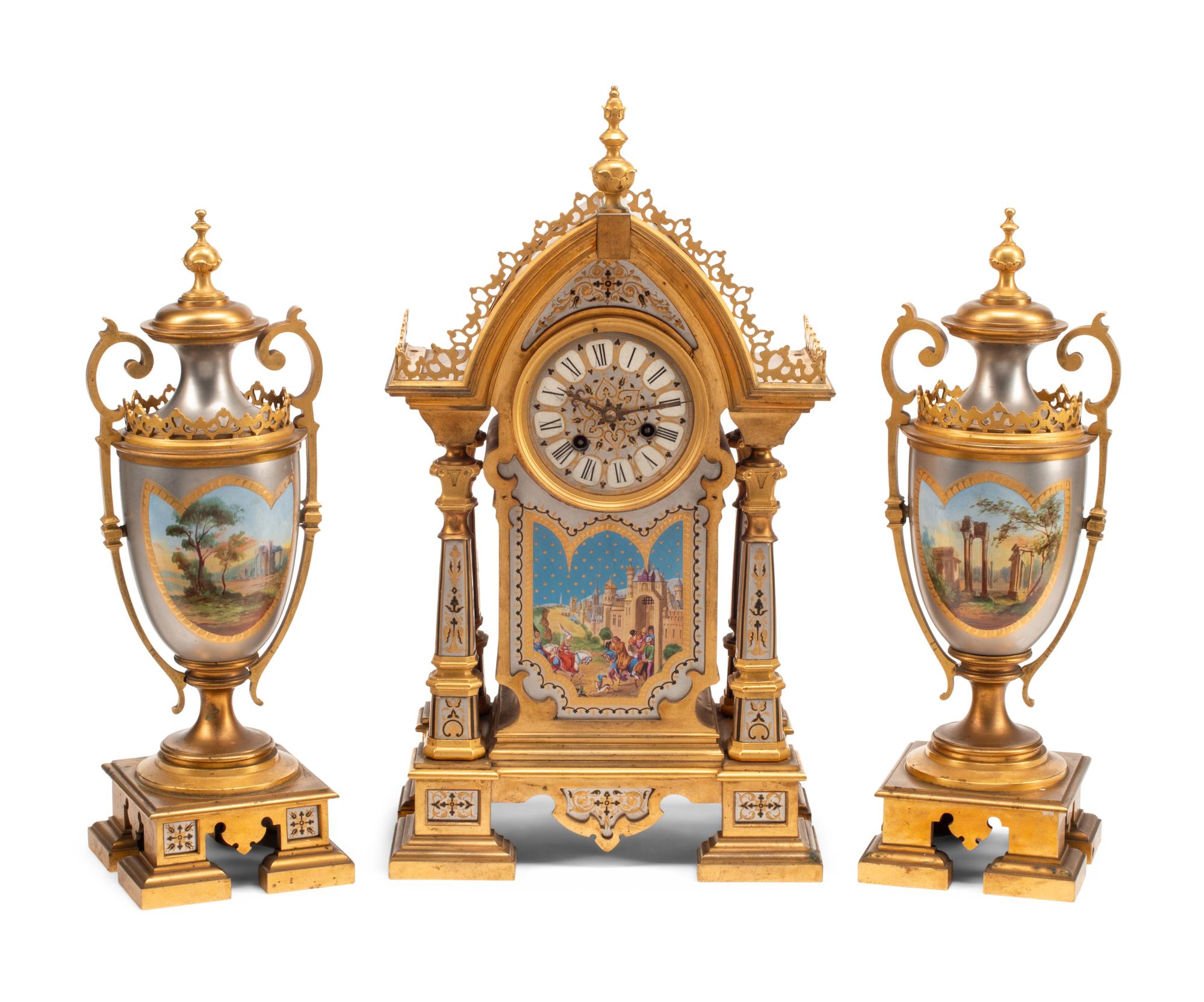 A French Gilt and Silvered Bronze and Porcelain Clock Garniture