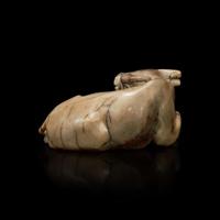 A Chinese partially calcified greyish-beige jade buffalo 灰白玉水牛擺件