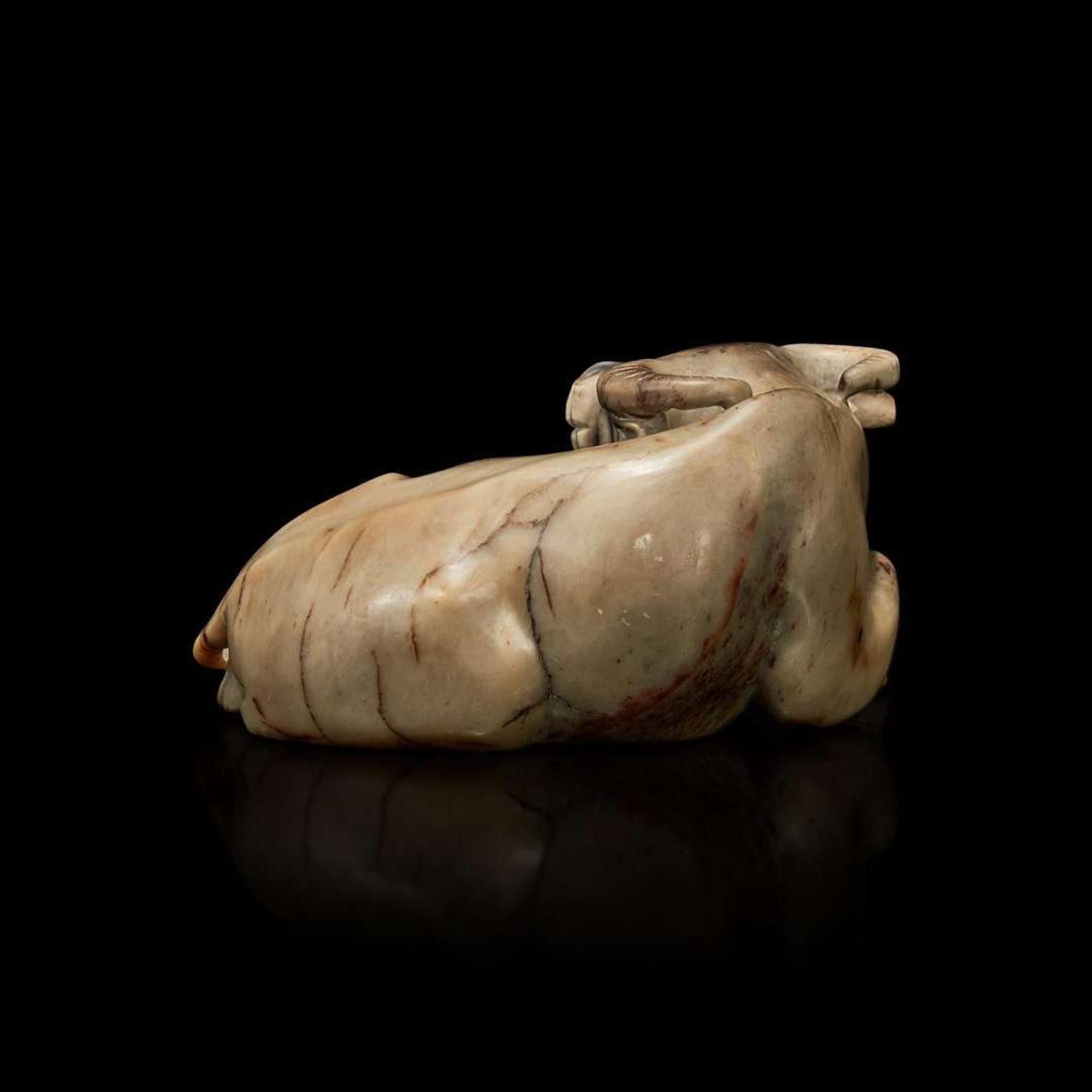 A Chinese partially calcified greyish-beige jade buffalo 灰白玉水牛擺件