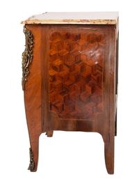 A Régence Style Bronze Mounted Marble Top Marquetry Commode